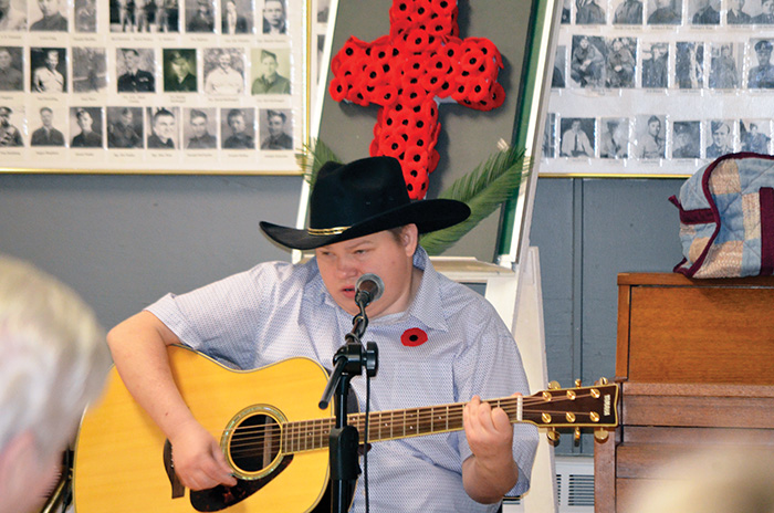 Ryan Bender played guitar and sang at the Legion dinner.